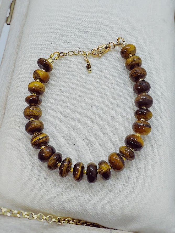 a bracelet made with tigers eye beads